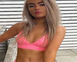 She has a piercing in her belly button alongside her nose and ears She has a piercing in her belly button alongside her nose and ears.